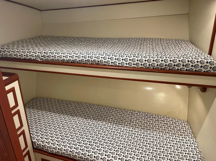 Red Witch Yacht Photos Pics Bunk beds with patterned mattresses in a 2001 Custom Carolina Lydia 57 Sportfish cabin.