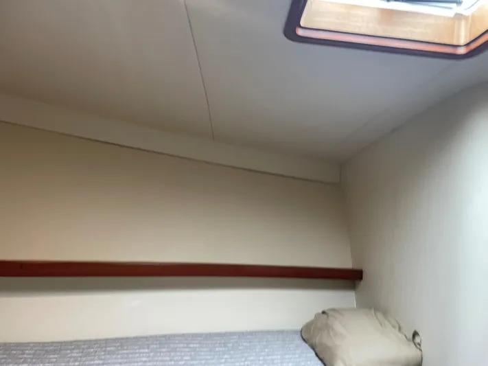 Red Witch Yacht Photos Pics Interior cabin of 2001 Custom Carolina Lydia 57 Sportfish with bed and skylight.