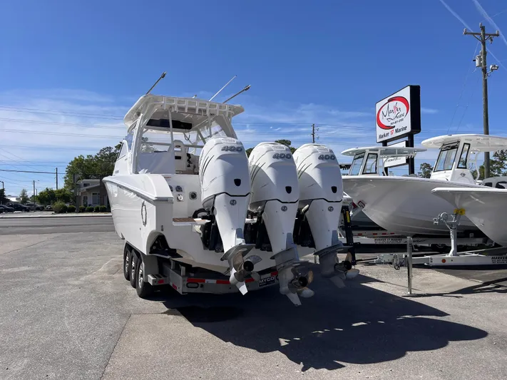  Yacht Photos Pics 2021 Fountain 38 SFC boat with triple 400 horsepower engines on a trailer.