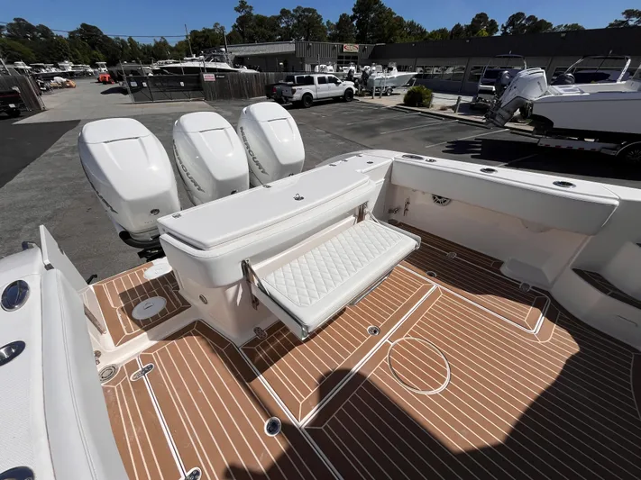  Yacht Photos Pics 2021 Fountain 38 SFC boat with triple outboard engines and spacious deck seating.
