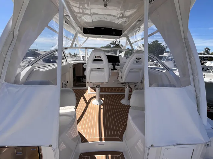 Yacht Photos Pics 2021 Fountain 38 SFC boat interior with white seating and wood flooring.
