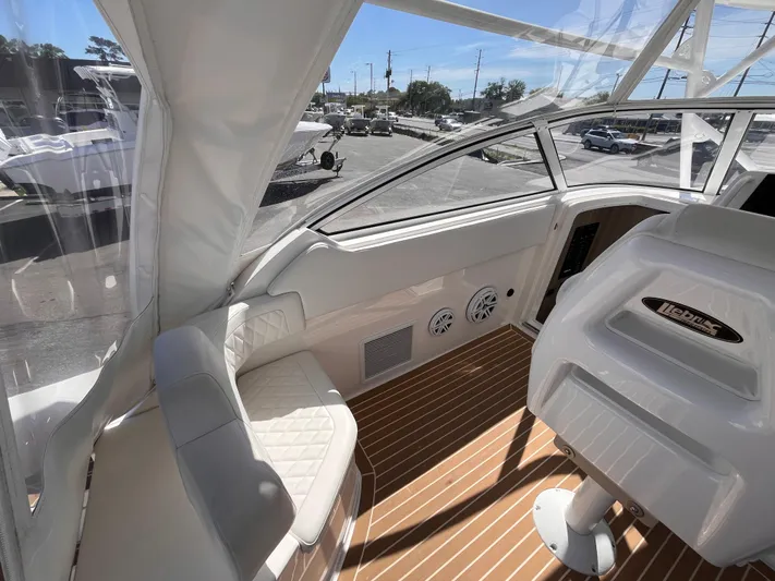  Yacht Photos Pics 2021 Fountain 38 SFC boat interior with white seating and wood-patterned flooring.