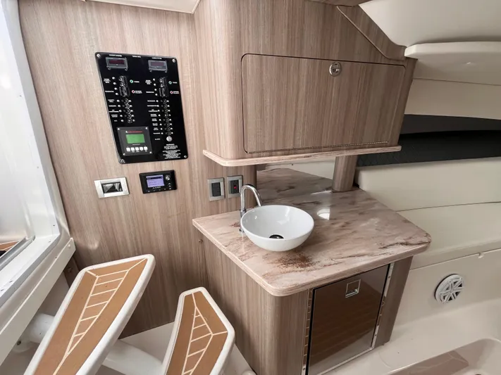  Yacht Photos Pics 2021 Fountain 38 SFC interior with modern sink and control panel.