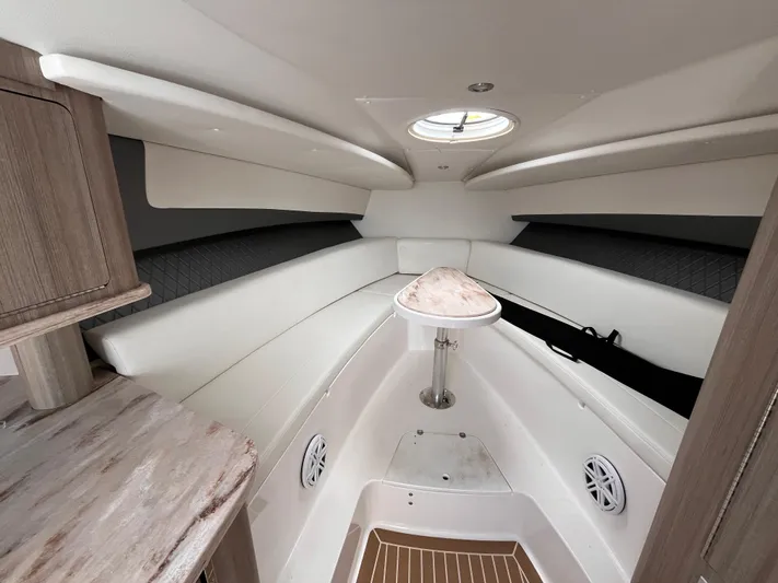  Yacht Photos Pics 2021 Fountain 38 SFC boat interior with white seating and wood accents.