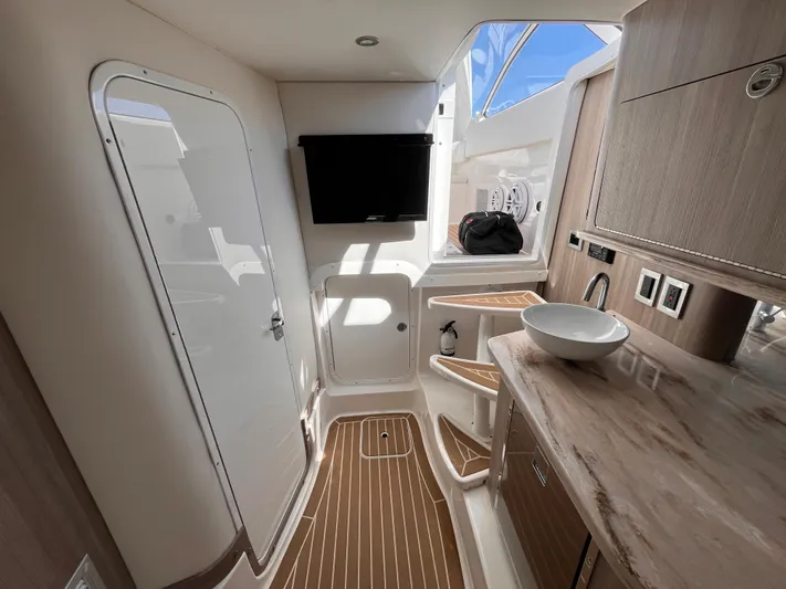  Yacht Photos Pics 2021 Fountain 38 SFC interior with modern amenities and sleek design.