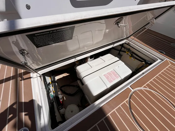  Yacht Photos Pics Open engine compartment of 2021 Fountain 38 SFC boat, showcasing internal components.