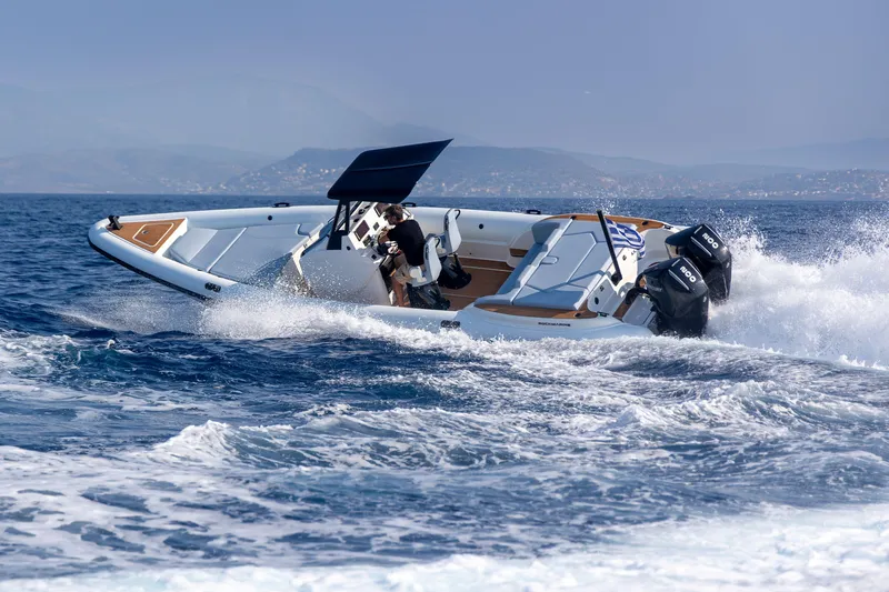 Rock Marine Rm 30 Yacht Photos Pics 2026 Rock Marine RM 30 speedboat cruising on open water with dual engines.