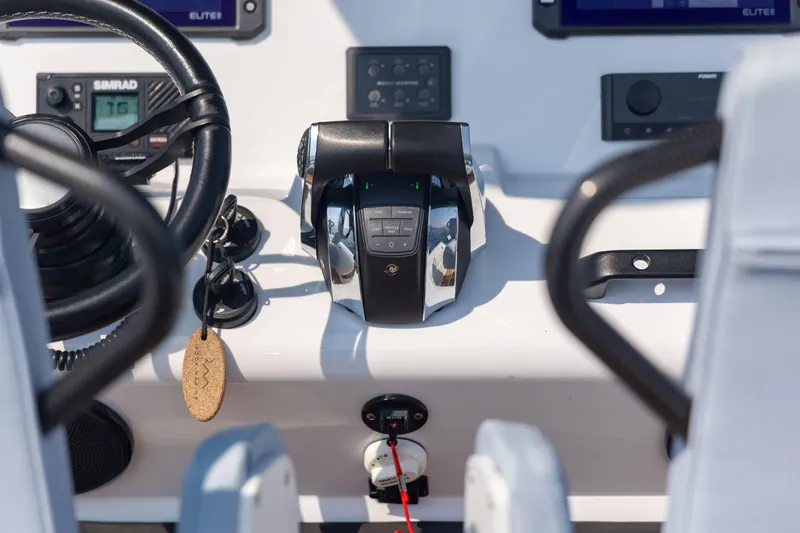 Rock Marine Rm 30 Yacht Photos Pics Control panel of 2026 Rock Marine RM 30 boat with steering wheel and throttle.