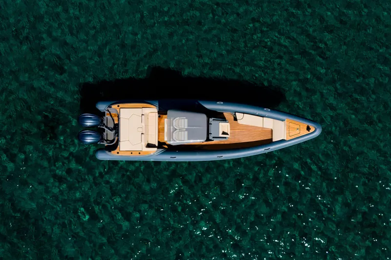 Rock Marine Rm 30 Yacht Photos Pics Top view of 2026 Rock Marine RM 30 boat on clear blue water.