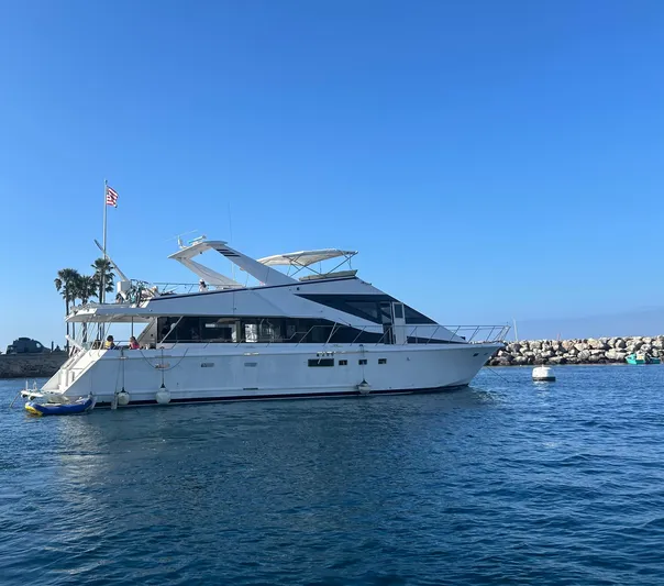 Scherzo Yacht Photos Pics A 1989 custom yacht anchored in calm blue waters under a clear sky.