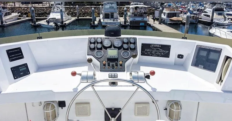 Scherzo Yacht Photos Pics Boat control panel with gauges and steering wheel, docked at marina, Custom model, 1989.