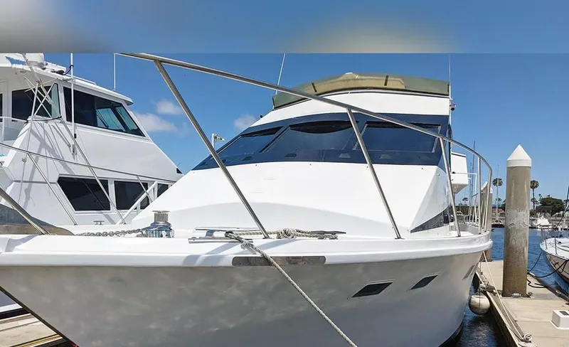 Scherzo Yacht Photos Pics Custom 1989 yacht docked at marina under clear blue sky.