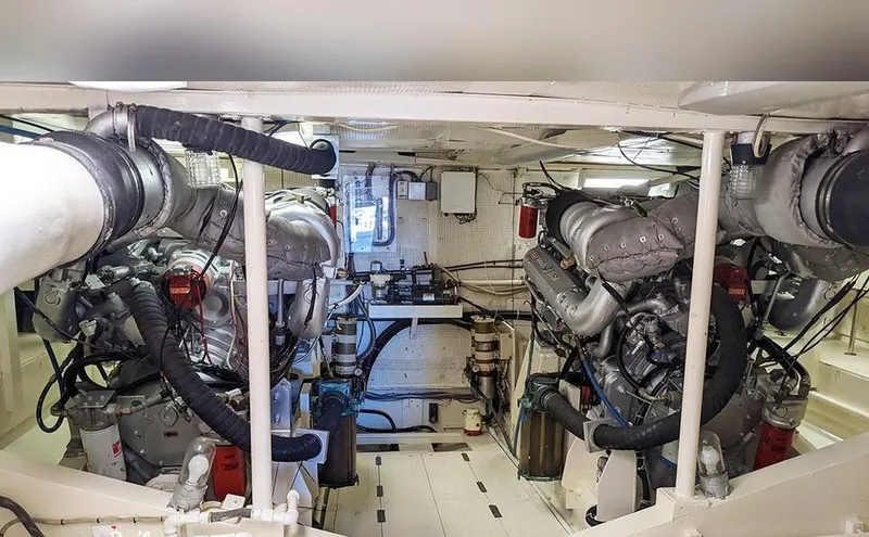 Scherzo Yacht Photos Pics Engine room with dual engines, custom model, 1989, featuring complex piping and machinery.