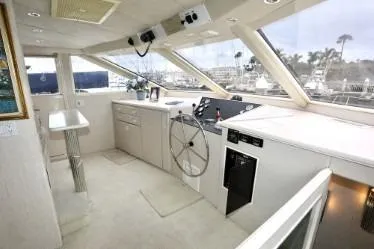 Scherzo Yacht Photos Pics Luxurious 1989 custom yacht interior with modern helm, panoramic windows, and sleek design.