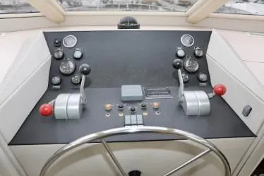 Scherzo Yacht Photos Pics Control panel of a 1989 custom boat with steering wheel and gauges.