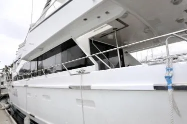 Scherzo Yacht Photos Pics White custom yacht docked, side view, 1989 model.