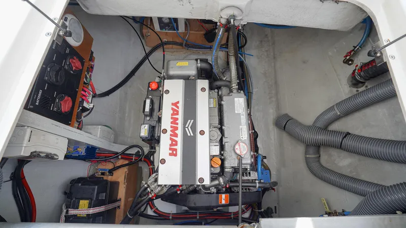 Good Times And Tan Lines Yacht Photos Pics Engine compartment of a 2023 Lagoon 42 catamaran with Yanmar engine.