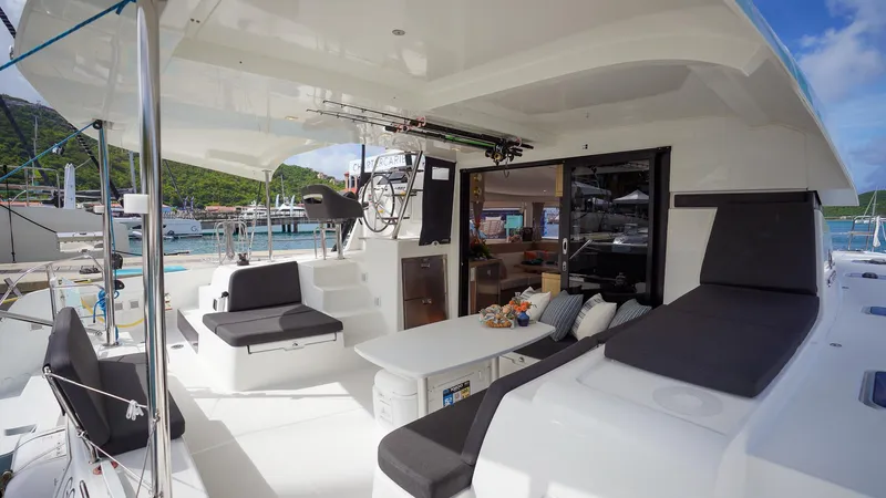 Good Times And Tan Lines Yacht Photos Pics 2023 Lagoon 42 catamaran with spacious outdoor seating and modern interior design.