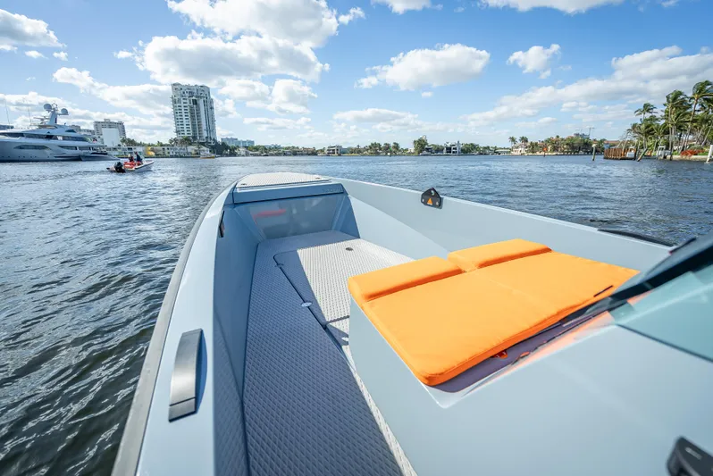  Yacht Photos Pics 2024 Goldfish 28 Tender boat with orange cushions on a sunny day.