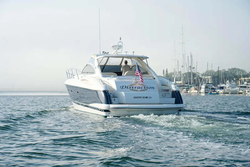 Distraction Yacht Photos Pics Sunseeker Camargue 50 yacht cruising in Newport Beach marina, 2000 model.