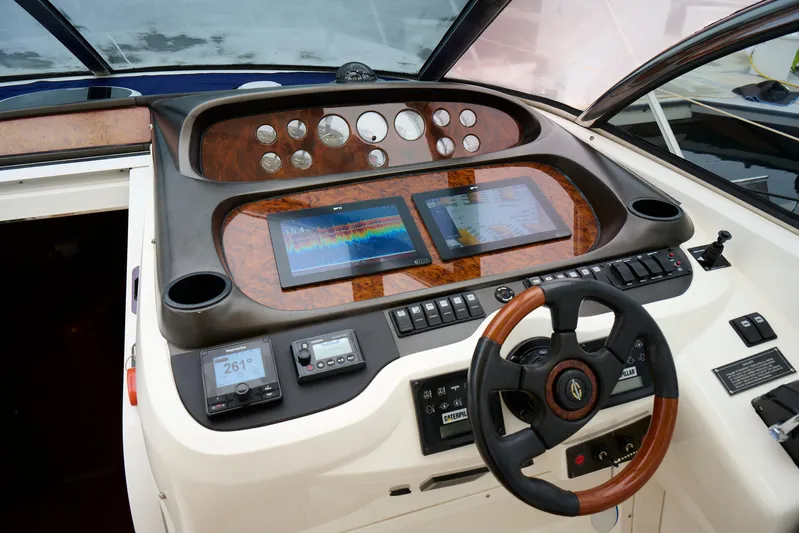 Distraction Yacht Photos Pics Sunseeker Camargue 50 yacht helm with navigation screens and controls, 2000 model.