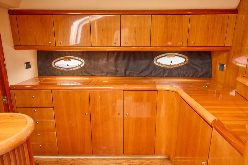 Distraction Yacht Photos Pics Luxurious wooden interior of 2000 Sunseeker Camargue 50 yacht kitchen.