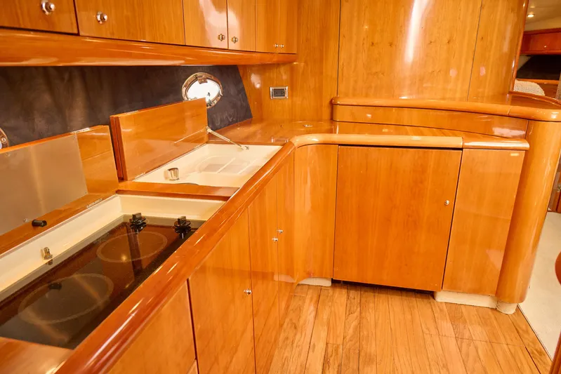 Distraction Yacht Photos Pics Luxurious wooden kitchen interior of 2000 Sunseeker Camargue 50 yacht.