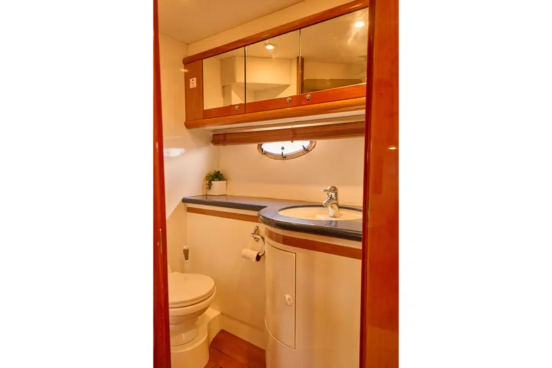 Distraction Yacht Photos Pics Luxurious bathroom in 2000 Sunseeker Camargue 50 yacht with elegant wood finishes.