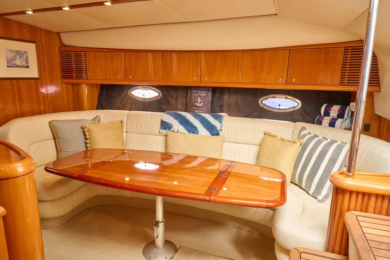 Distraction Yacht Photos Pics Luxurious interior of 2000 Sunseeker Camargue 50 yacht with elegant wood finishes.