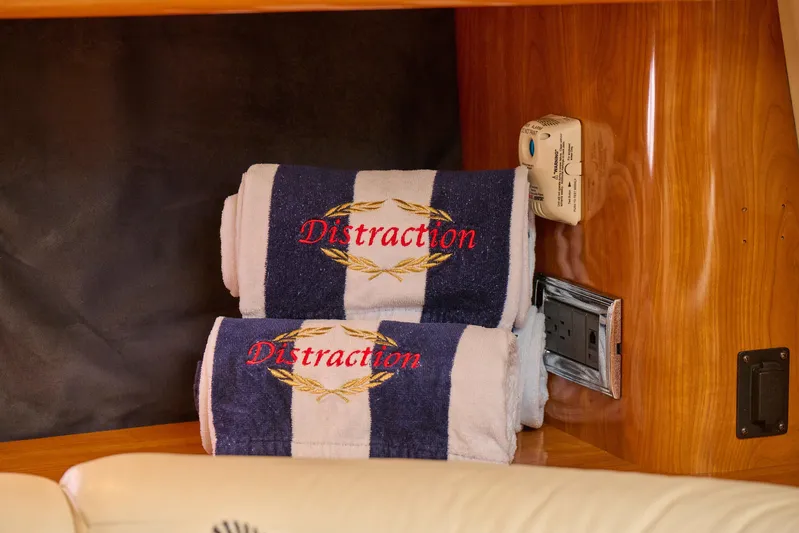 Distraction Yacht Photos Pics Embroidered towels on Sunseeker Camargue 50 yacht, 2000 model, with wood paneling.
