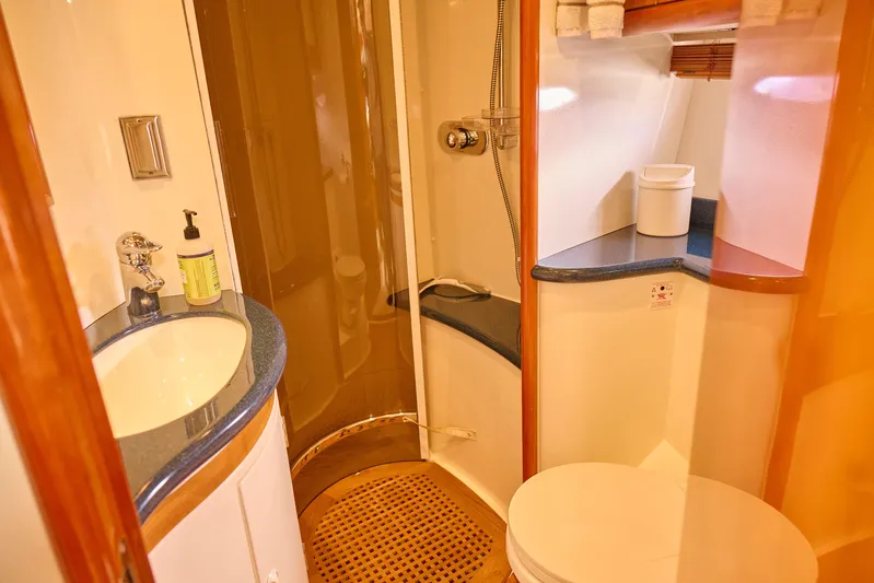Distraction Yacht Photos Pics Luxurious bathroom in 2000 Sunseeker Camargue 50 yacht with modern amenities.