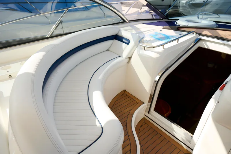 Distraction Yacht Photos Pics Luxurious Sunseeker Camargue 50 yacht interior with elegant white seating, 2000 model.