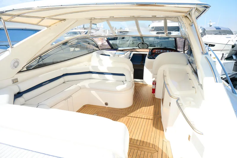 Distraction Yacht Photos Pics Luxurious Sunseeker Camargue 50 yacht interior, 2000 model, featuring elegant seating and wooden flooring.