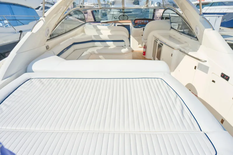 Distraction Yacht Photos Pics Luxurious Sunseeker Camargue 50 yacht interior, 2000 model, featuring elegant white seating.