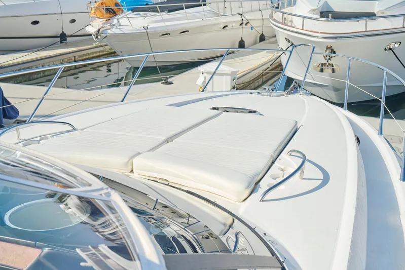 Distraction Yacht Photos Pics Sunseeker Camargue 50 yacht, 2000 model, docked with sunbathing area visible.