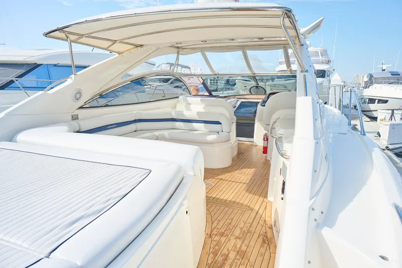 Distraction Yacht Photos Pics Luxury Sunseeker Camargue 50 yacht interior, 2000 model, featuring spacious seating and elegant design.