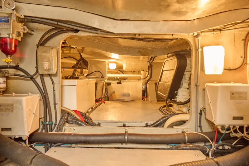 Distraction Yacht Photos Pics Engine room of 2000 Sunseeker Camargue 50 yacht, showcasing mechanical components and wiring.