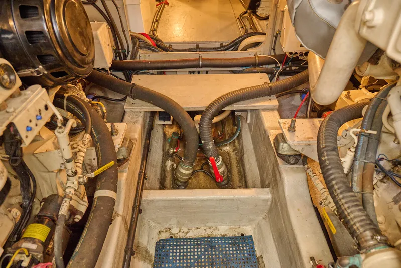 Distraction Yacht Photos Pics Engine room of a 2000 Sunseeker Camargue 50 yacht, showcasing mechanical components.