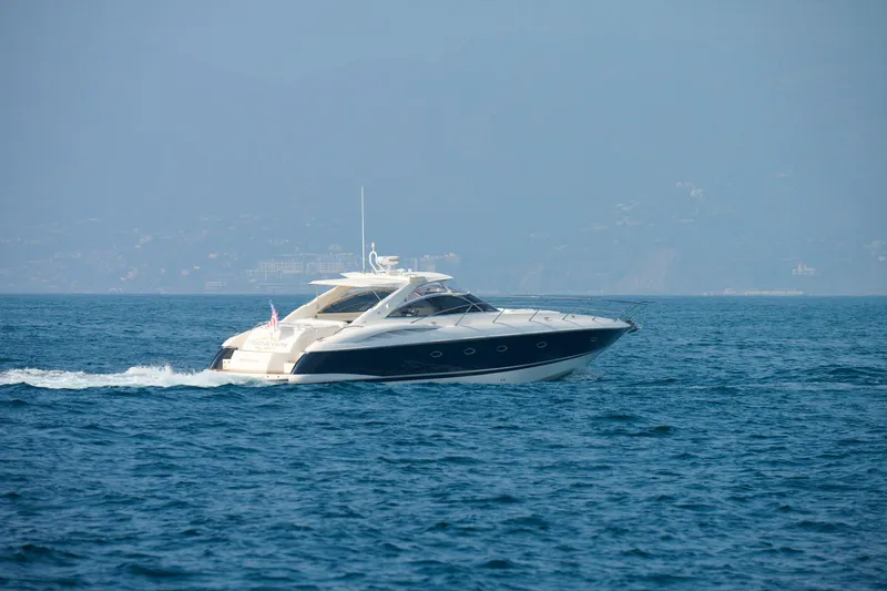 Distraction Yacht Photos Pics 2000 Sunseeker Camargue 50 yacht cruising on open water.