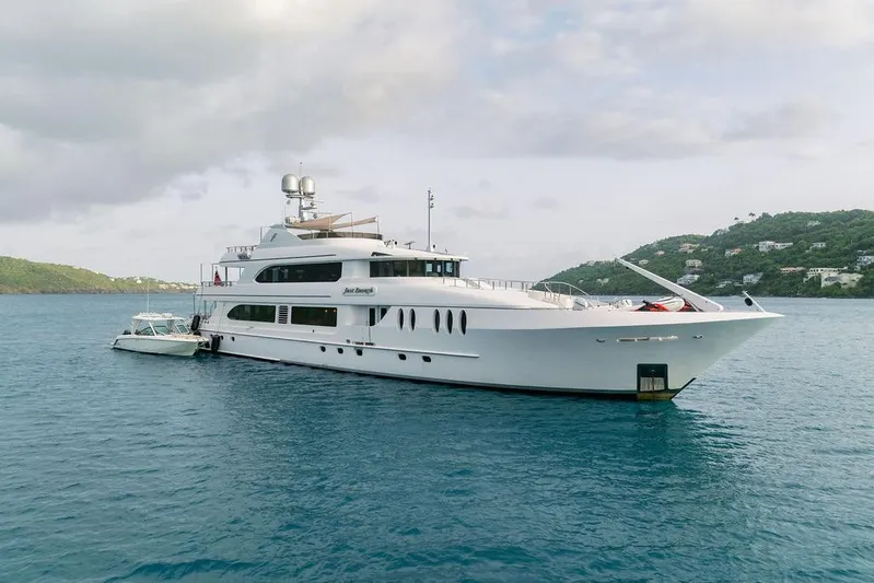 Just Enough Yacht Photos Pics Luxury yacht Ares Custom Marine Custom 141, 2012, anchored in scenic coastal waters.