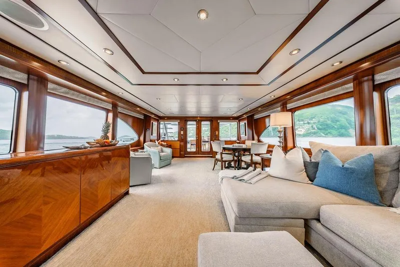 Just Enough Yacht Photos Pics Luxurious interior of 2012 Ares Custom Marine Custom 141 yacht with elegant wood finishes.