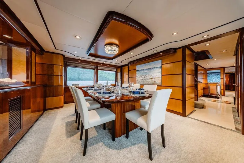 Just Enough Yacht Photos Pics Luxurious dining area on 2012 Ares Custom Marine Custom 141 yacht, featuring elegant decor and scenic views.