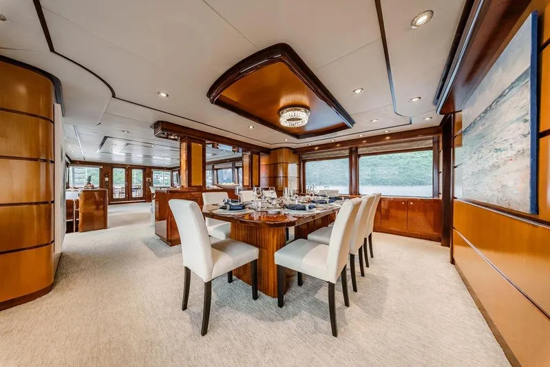 Just Enough Yacht Photos Pics Luxurious dining area on 2012 Ares Custom Marine Custom 141 yacht, featuring elegant decor and large windows.