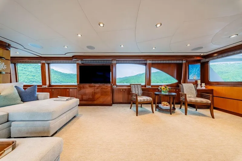 Just Enough Yacht Photos Pics Luxurious interior of 2012 Ares Custom Marine Custom 141 yacht with elegant seating and scenic views.