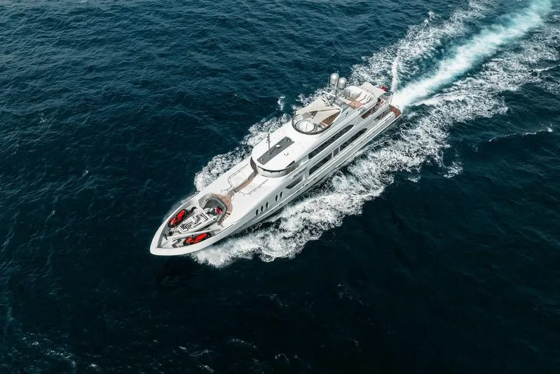Just Enough Yacht Photos Pics Aerial view of 2012 Ares Custom Marine Custom 141 yacht cruising on open sea.