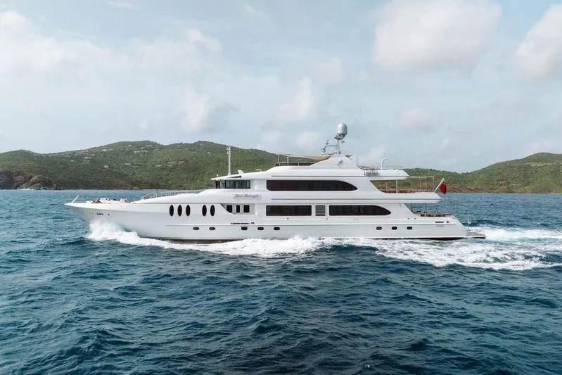 Just Enough Yacht Photos Pics Luxurious 2012 Ares Custom Marine 141 yacht cruising in scenic ocean waters.