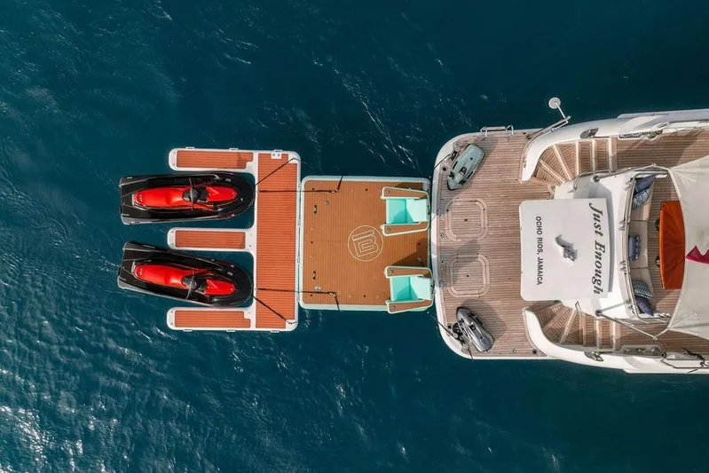 Just Enough Yacht Photos Pics Aerial view of 2012 Ares Custom Marine Custom 141 yacht with jet skis on deck.