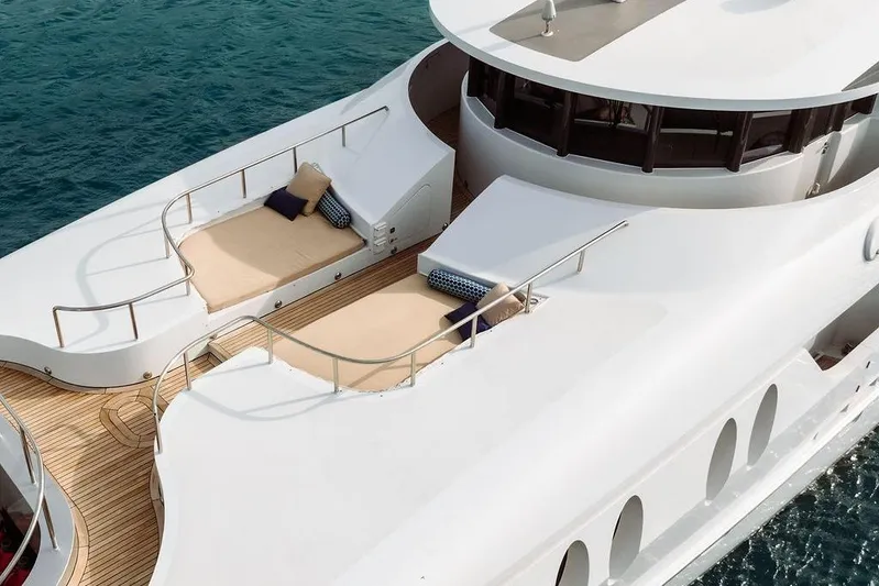 Just Enough Yacht Photos Pics Luxury yacht Ares Custom Marine 141, 2012 model, featuring elegant deck lounging area.