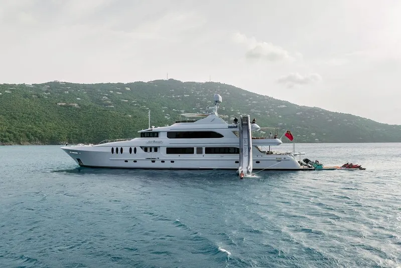 Just Enough Yacht Photos Pics Luxury yacht Ares Custom Marine Custom 141, 2012, anchored near lush green hills.