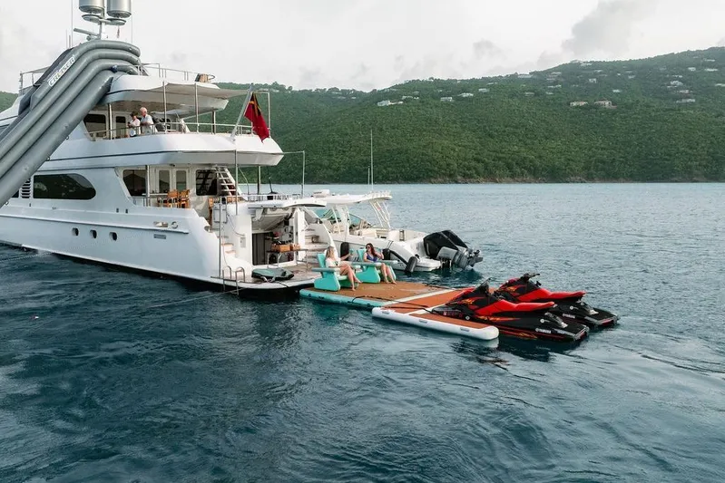 Just Enough Yacht Photos Pics Luxury yacht Ares Custom Marine 141 with water toys and slide, 2012 model, anchored in scenic bay.